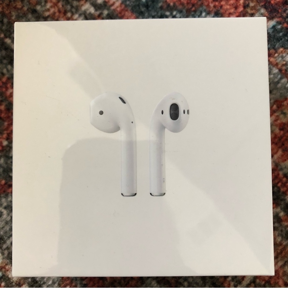 Unopened Apple AirPods shrink wrapped brand new.